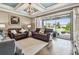 Inviting living room with sliding glass doors that open to the backyard and lots of natural light at 14110 Barrington Stowers Dr, Lithia, FL 33547