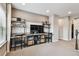 Cozy living room featuring wall-mounted shelving units, and modern entertainment center at 14110 Barrington Stowers Dr, Lithia, FL 33547