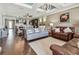 Warm and inviting living room with view of kitchen and dining area at 14110 Barrington Stowers Dr, Lithia, FL 33547