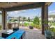 Beautiful covered patio features a full outdoor kitchen, seating and fire pit at 14110 Barrington Stowers Dr, Lithia, FL 33547