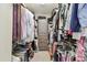 Spacious walk-in closet with custom shelves, drawers, and ample hanging space at 14110 Barrington Stowers Dr, Lithia, FL 33547