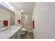 Bright bathroom featuring a shower with glass doors, stylish vanity, and modern fixtures at 1508 Ingram Dr # 20, Sun City Center, FL 33573