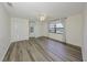 Empty bedroom featuring wood floors, neutral walls, many windows and a ceiling fan at 1508 Ingram Dr # 20, Sun City Center, FL 33573