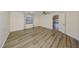 Empty room featuring wood floors, neutral walls, a window and ceiling fan at 1508 Ingram Dr # 20, Sun City Center, FL 33573