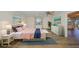 Bright bedroom featuring stylish furniture, neutral walls, wood floors and a ceiling fan at 1508 Ingram Dr # 20, Sun City Center, FL 33573