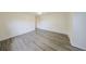 Neutral room with new wood floors and a large closet at 1508 Ingram Dr # 20, Sun City Center, FL 33573