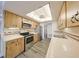 Fully equipped kitchen with stainless steel appliances, tile countertops, and plenty of storage space at 1508 Ingram Dr # 20, Sun City Center, FL 33573