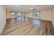 Spacious living room featuring hardwood floors, ceiling fans, recessed lighting, and lots of natural light at 1508 Ingram Dr # 20, Sun City Center, FL 33573