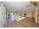Staged living room featuring hardwood floors, modern decor, ceiling fans, recessed lighting, and lots of natural light at 1508 Ingram Dr # 20, Sun City Center, FL 33573