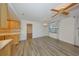 Bright living room featuring wood floors, classic ceiling fan, and natural light from the window at 1508 Ingram Dr # 20, Sun City Center, FL 33573