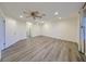 Spacious room featuring neutral walls, wood floors, recessed lighting and a ceiling fan at 1508 Ingram Dr # 20, Sun City Center, FL 33573