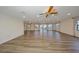 Spacious living room featuring hardwood floors, ceiling fans, recessed lighting, and lots of natural light at 1508 Ingram Dr # 20, Sun City Center, FL 33573