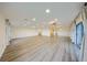 Expansive living room with hardwood floors and recessed lighting perfect for entertaining guests at 1508 Ingram Dr # 20, Sun City Center, FL 33573