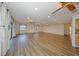 Spacious living room with hardwood floors, recessed lighting, and sliding glass doors for natural light at 1508 Ingram Dr # 20, Sun City Center, FL 33573