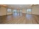 Spacious living room featuring hardwood floors, ceiling fans, recessed lighting, and lots of natural light at 1508 Ingram Dr # 20, Sun City Center, FL 33573