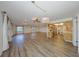 Open-concept living room featuring hardwood floors, recessed lighting, and view to the kitchen at 1508 Ingram Dr # 20, Sun City Center, FL 33573