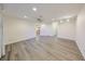 Neutral living room featuring wood floors, recessed lighting and a ceiling fan at 1508 Ingram Dr # 20, Sun City Center, FL 33573