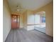 Covered porch with ceiling fan, and decorative front door at 1508 Ingram Dr # 20, Sun City Center, FL 33573