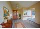Staged covered porch with ceiling fan, furniture, decor, and decorative front door at 1508 Ingram Dr # 20, Sun City Center, FL 33573