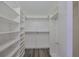 Bright walk-in closet with many shelves and hanging space at 1508 Ingram Dr # 20, Sun City Center, FL 33573