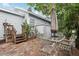 Backyard patio area with an outdoor table and chairs, accessed by wooden stairs off the house at 1525 38Th N Ave, St Petersburg, FL 33704