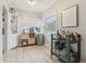 Inviting bar area with unique storage solutions, mini fridge, and stylish bar cart at 1525 38Th N Ave, St Petersburg, FL 33704