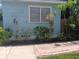 Landscaped exterior with garden featuring a patterned brick walkway at 1525 38Th N Ave, St Petersburg, FL 33704