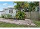 Charming single-story home with a well-maintained lawn, landscaped bushes and a paved walkway at 1525 38Th N Ave, St Petersburg, FL 33704