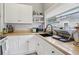 Bright kitchen area featuring wooden countertops, white cabinets, and modern appliances at 1525 38Th N Ave, St Petersburg, FL 33704