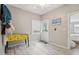 Versatile room with wood-look flooring, window, and adjacent room at 1525 38Th N Ave, St Petersburg, FL 33704