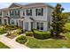 Attractive townhome featuring manicured landscaping, and inviting front entry at 15430 Caravan Ave, Odessa, FL 33556