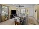 Bright living room with large windows, tile floors, and a comfortable sectional sofa at 15430 Caravan Ave, Odessa, FL 33556