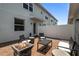 Private patio with a brick floor, a fire pit, and outdoor seating for entertaining at 15430 Caravan Ave, Odessa, FL 33556