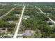 Aerial view of houses surrounded by dense pine forest at 16473 Scaup Duck Ave, Weeki Wachee, FL 34614
