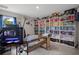 Charming bedroom featuring custom bookshelf and neutral color palette at 16473 Scaup Duck Ave, Weeki Wachee, FL 34614