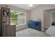 Dining area with a view to the backyard and a blue buffet for storage at 16473 Scaup Duck Ave, Weeki Wachee, FL 34614
