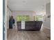 Open-concept living area with modern flooring, neutral color palette, and plenty of natural light at 16473 Scaup Duck Ave, Weeki Wachee, FL 34614