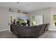 Spacious living room with a large television and modern decor at 16473 Scaup Duck Ave, Weeki Wachee, FL 34614