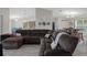 Comfortable living room with a large sectional sofa, modern decor, and plenty of space for relaxation at 16473 Scaup Duck Ave, Weeki Wachee, FL 34614