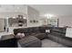 Open concept living room flowing into the kitchen and dining areas, perfect for entertaining at 16473 Scaup Duck Ave, Weeki Wachee, FL 34614