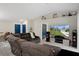 Cozy living area with blue doors, recessed lighting and exterior views on television screen at 16473 Scaup Duck Ave, Weeki Wachee, FL 34614