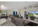 Relaxing living room with modern gray flooring and comfortable seating at 16473 Scaup Duck Ave, Weeki Wachee, FL 34614