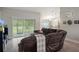 Comfortable living room with a large sectional couch and view of the backyard at 16473 Scaup Duck Ave, Weeki Wachee, FL 34614