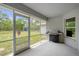Screened patio with a view of a large lawn and outdoor shed at 16473 Scaup Duck Ave, Weeki Wachee, FL 34614