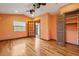 Bedroom with hardwood floors, closet, and natural light at 1721 Allens Creek Dr, Clearwater, FL 33764