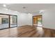 Light-filled bedroom with sliding glass doors leading to pool and waterfront views at 1721 Allens Creek Dr, Clearwater, FL 33764