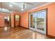 Bedroom with hardwood floors and patio access at 1721 Allens Creek Dr, Clearwater, FL 33764