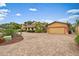 Exterior elevation of the property with a brick driveway and meticulously maintained landscaping with mature trees at 1721 Allens Creek Dr, Clearwater, FL 33764
