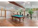 Sun-filled game room with a pool table and plenty of space for entertaining at 1721 Allens Creek Dr, Clearwater, FL 33764