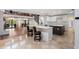 Open kitchen with quartz countertop island, white cabinets and stainless appliances at 1721 Allens Creek Dr, Clearwater, FL 33764